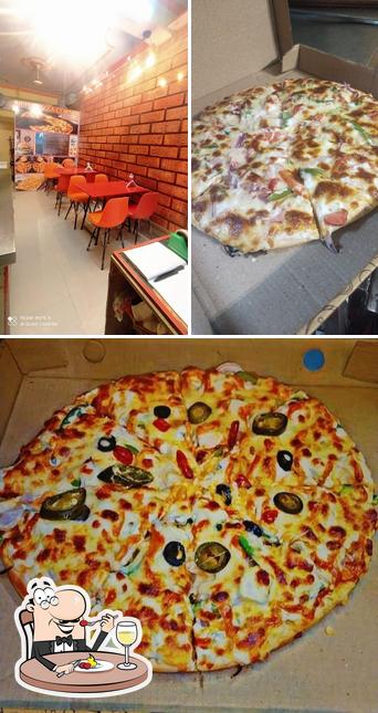 Take a look at the photo displaying food and interior at Neha Pizza Corner