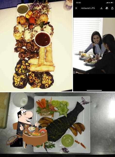 Among different things one can find food and dining table at Urban Lounge