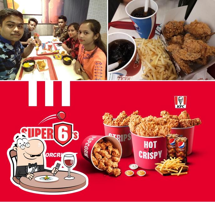 Check out the photo showing food and dining table at KFC