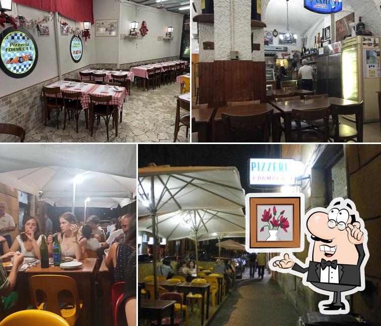 Siediti a un tavolo di Pizzeria Formula 1