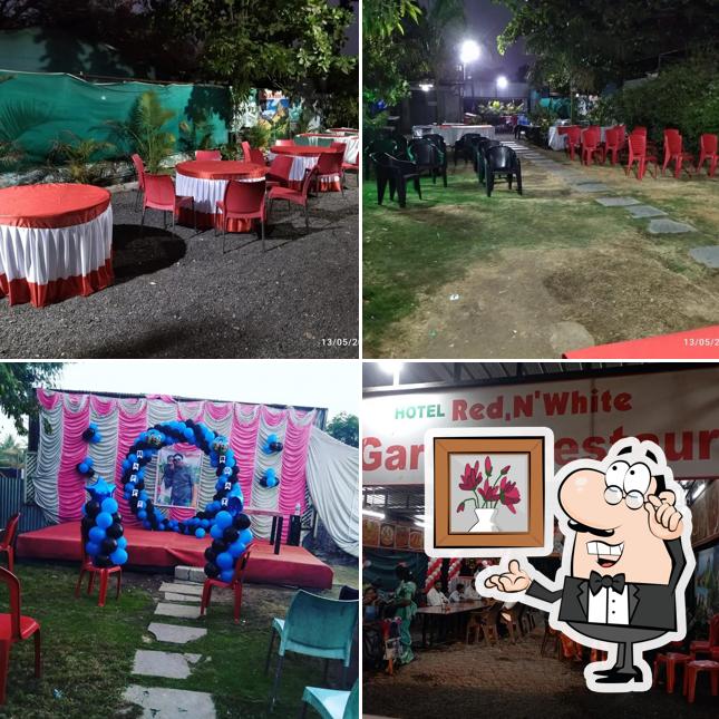 The interior of Hotel Red N' White Veg Garden Restaurant
