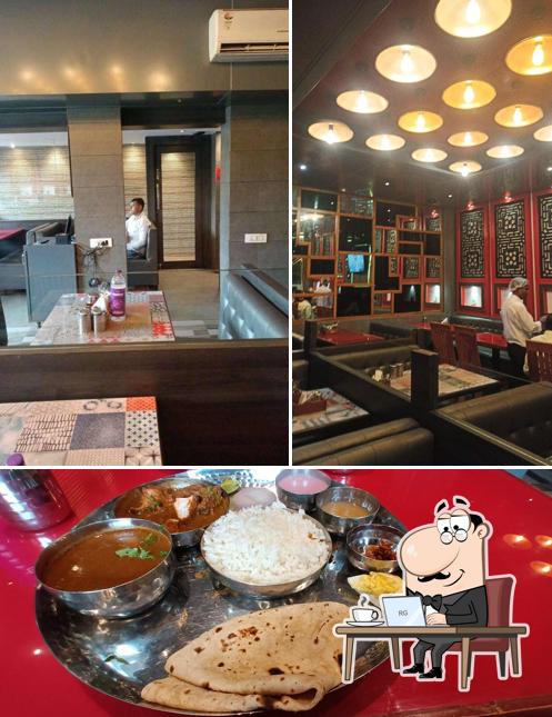 Check out the photo showing interior and food at Konkan Curry Seafood Restaurant