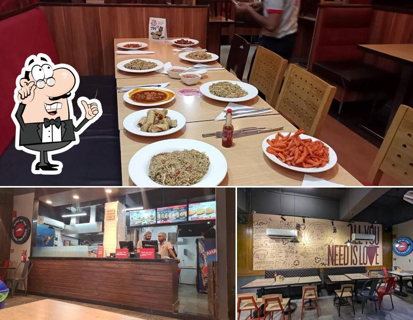 Take a seat at one of the tables at Pizza Hut Swaroop Nagar, Kanpur