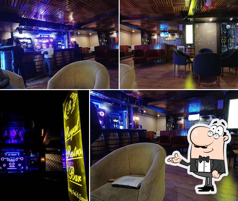 Take a seat at one of the tables at Royal Restro Bar