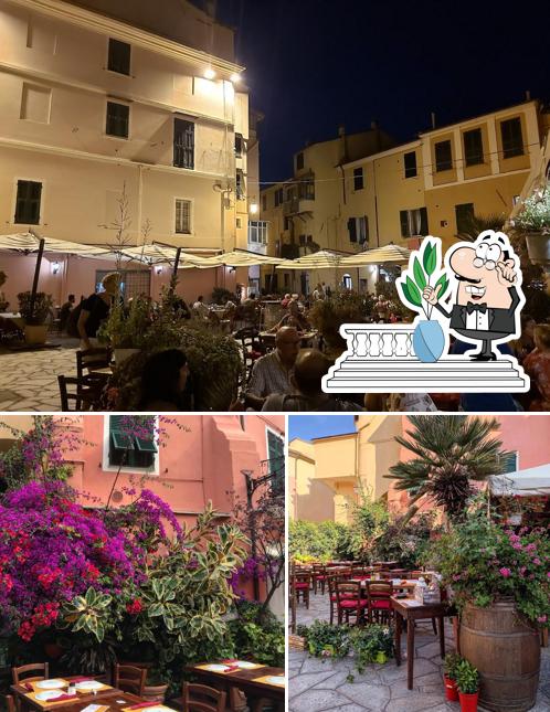 Questa è la immagine che presenta la esterno e interni di Oasi La Pizza