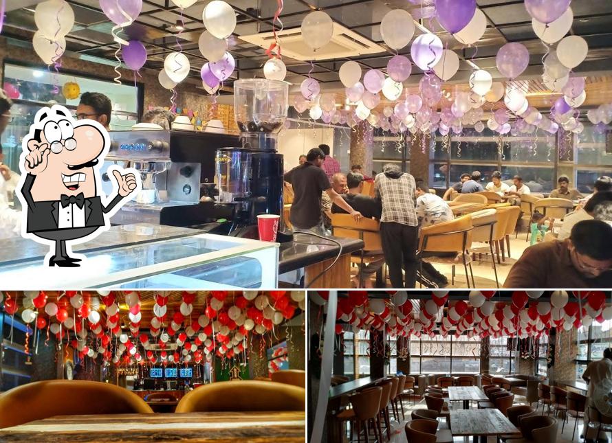 Take a seat at one of the tables at The Vintage Eluru