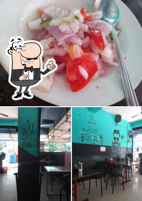 Check out the image depicting interior and dessert at ദേ ചെറീക്കാ൯െ് കട