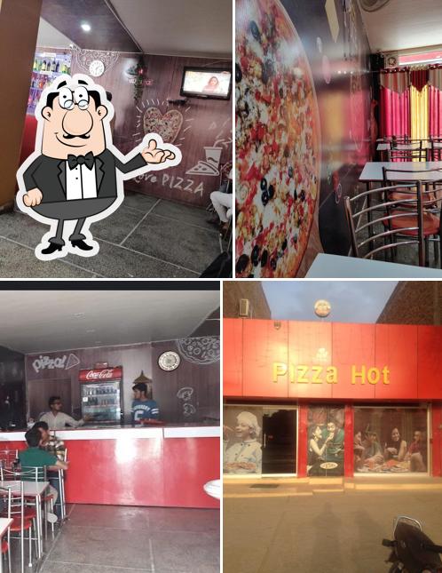 Take a seat at one of the tables at Pizza Hot
