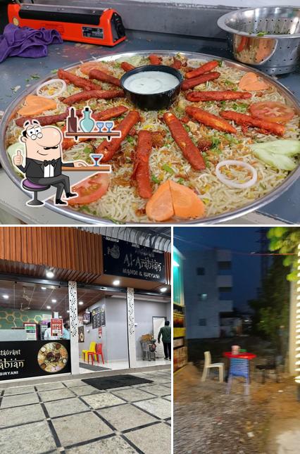 This is the picture showing interior and food at Al Arabian Mandi & Biryani