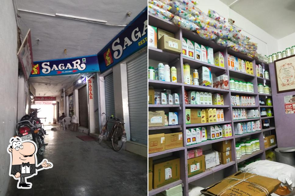 Take a seat at one of the tables at Sagar Restaurant