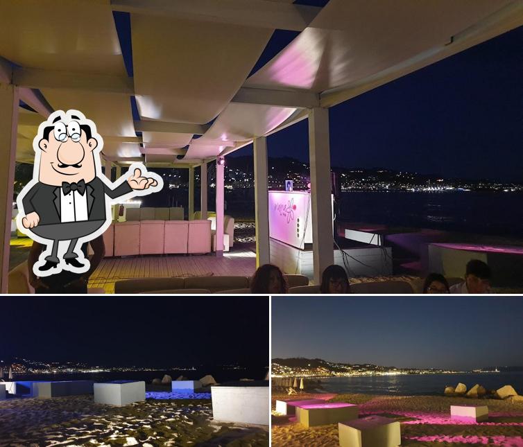 La immagine della interni e cibo di M'ama Beach Club