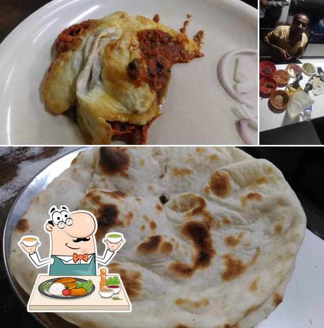 This is the image depicting food and dining table at Raj Hotel