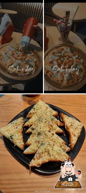 Order pizza at The Happy Place Cafe
