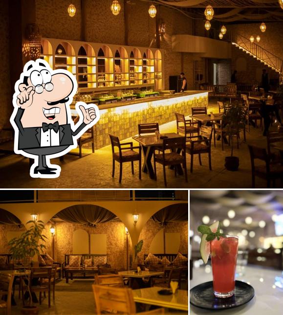 This is the picture depicting interior and beverage at Bombay Bistro
