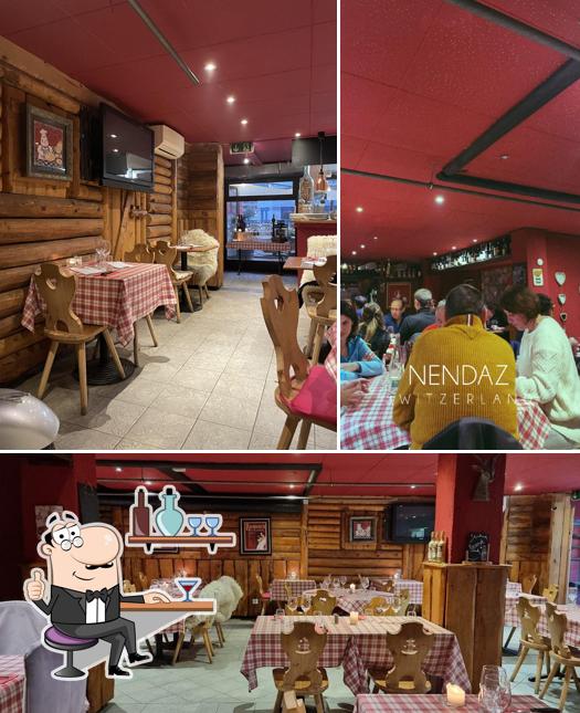 Siediti a un tavolo di Restaurant Les Flambeaux