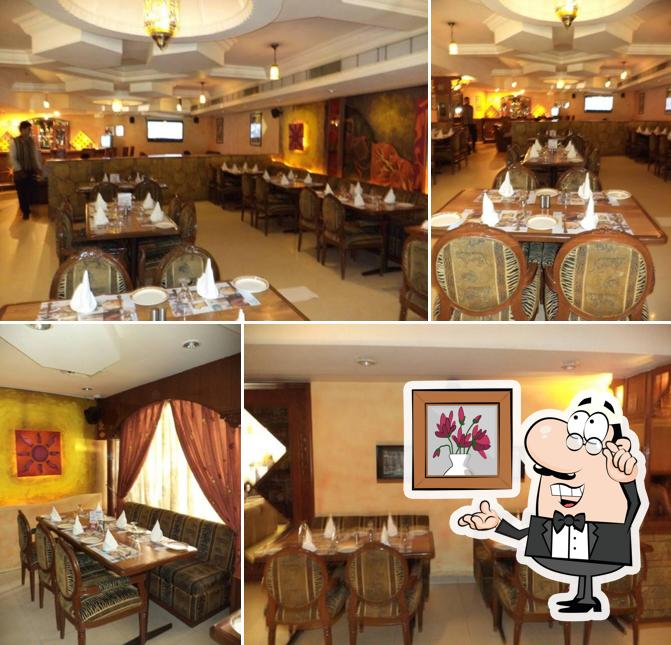 Take a seat at one of the tables at Spices - Hotel Park Inn