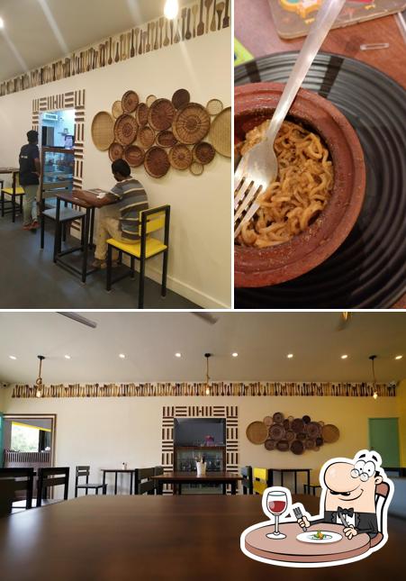 Take a look at the photo depicting food and interior at Yazh Cafe