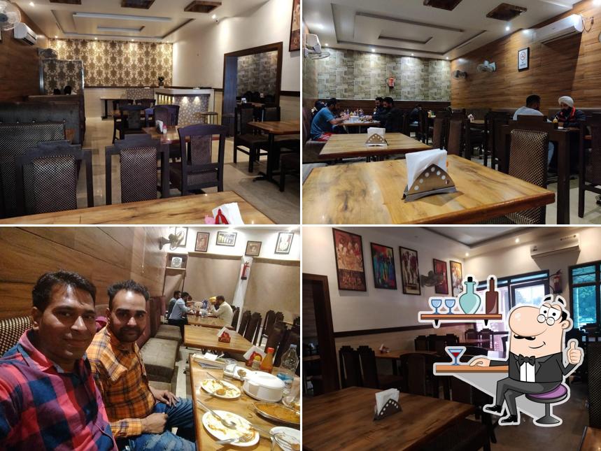 Take a seat at one of the tables at New Green Restaurant & Beer Bar