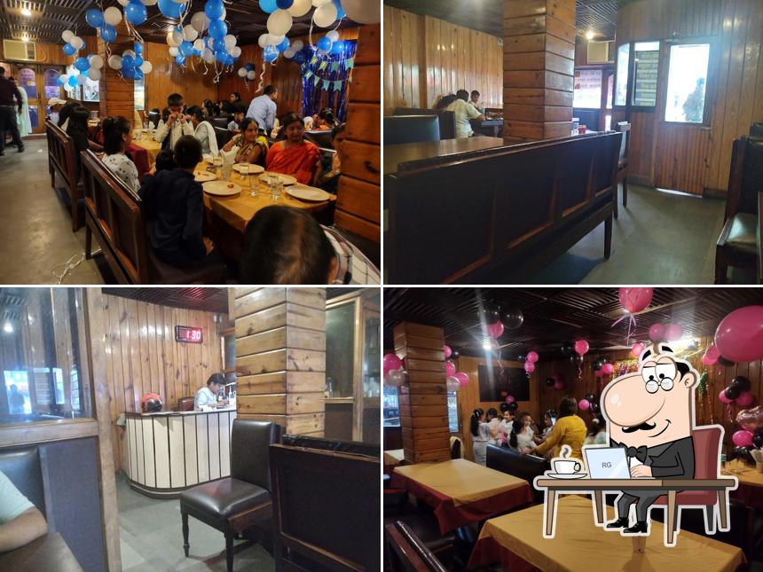 Take a seat at one of the tables at Kaveri Restaurant