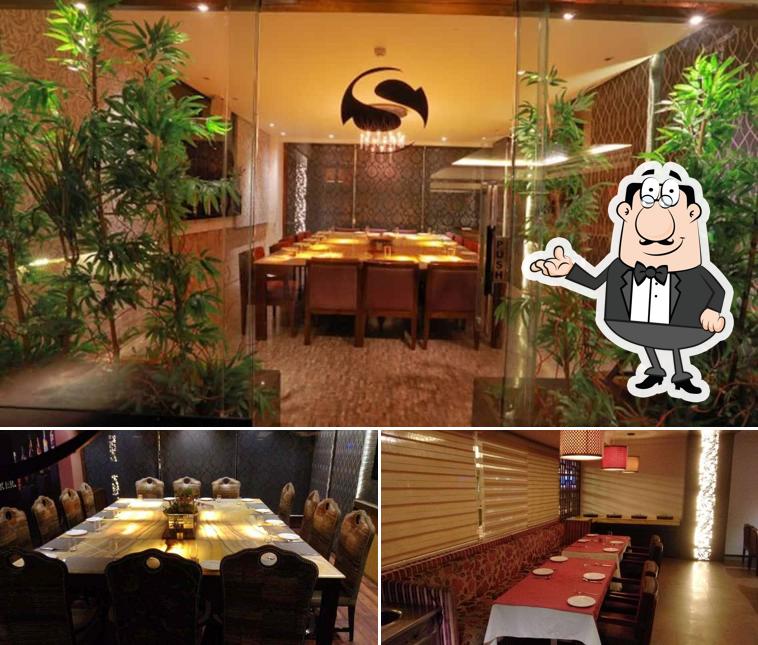 Take a seat at one of the tables at Machaan