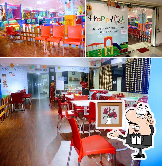 Take a seat at one of the tables at HappyPola - Indoor Amusement Park