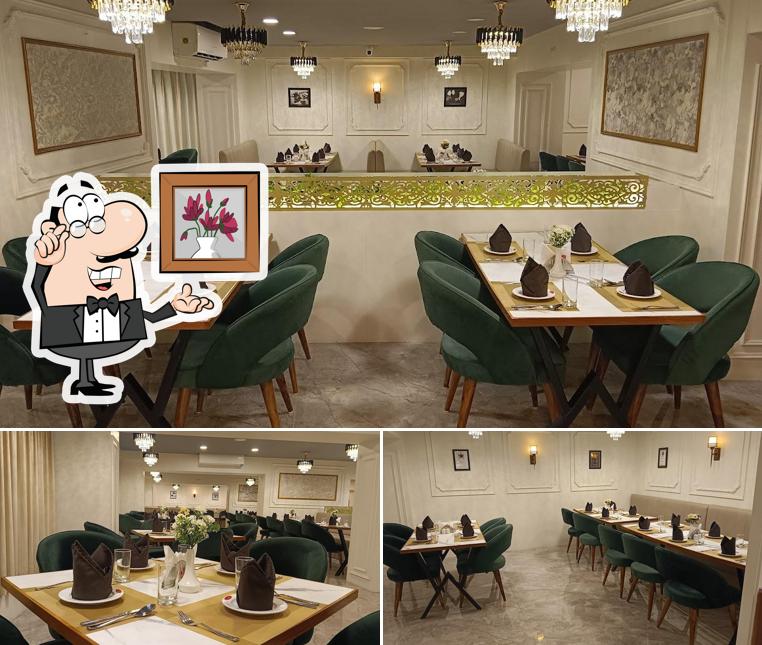 Take a seat at one of the tables at Moti Mahal Restaurant Indore