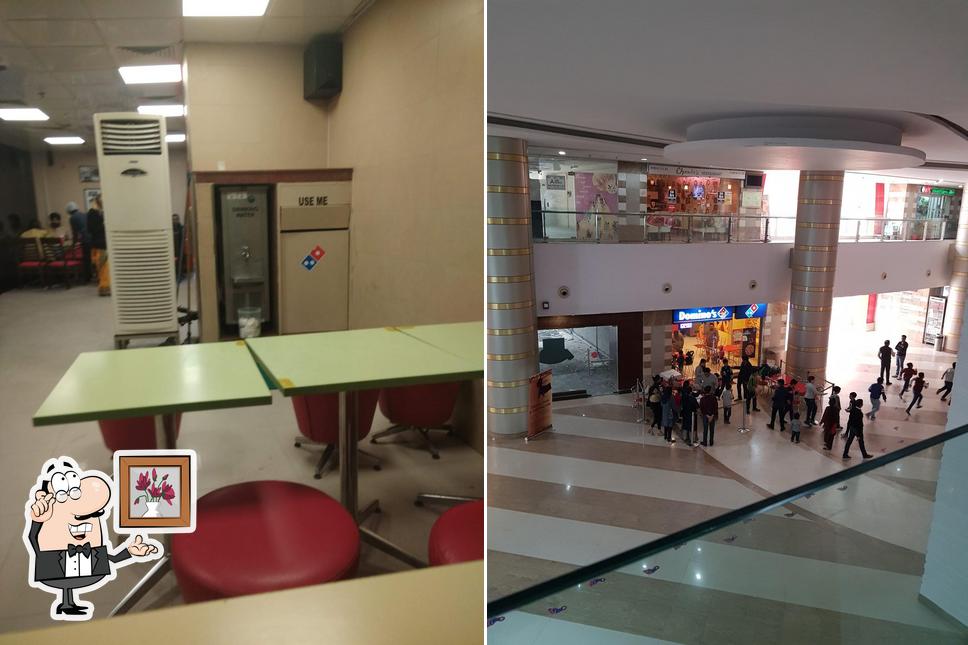 Take a seat at one of the tables at Domino's Pizza Sector 47, Gurugram