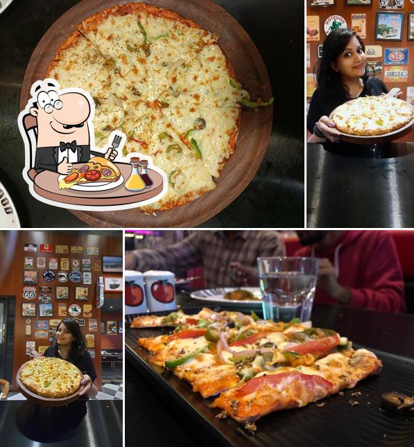Try out pizza at Tomato's Nashik Restaurant & Bar