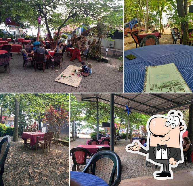 Take a seat at one of the tables at Oottupura Vegetarian Restaurant