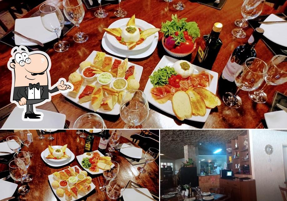 Sente em uma das mesas no Il Filetto Ristorante