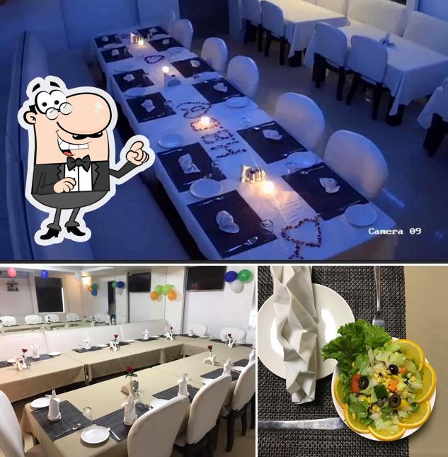 Check out the picture depicting interior and food at Madhura Restaurants