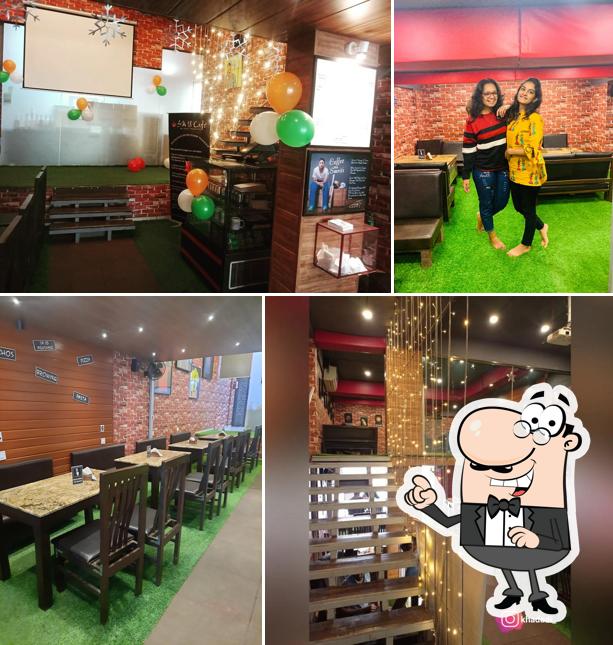 Take a seat at one of the tables at SM 18 Cafe By Smriti Mandhana