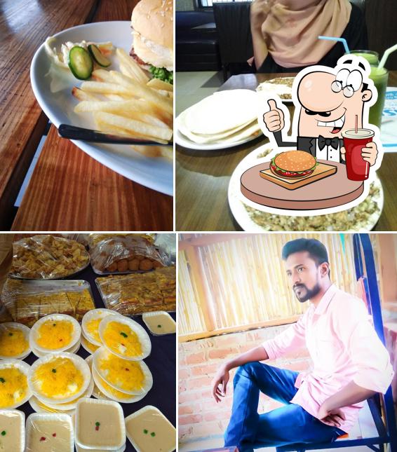 Order a burger at MANHAL RESTO