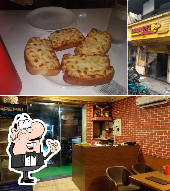 Take a seat at one of the tables at Smokin Joe's Wadala