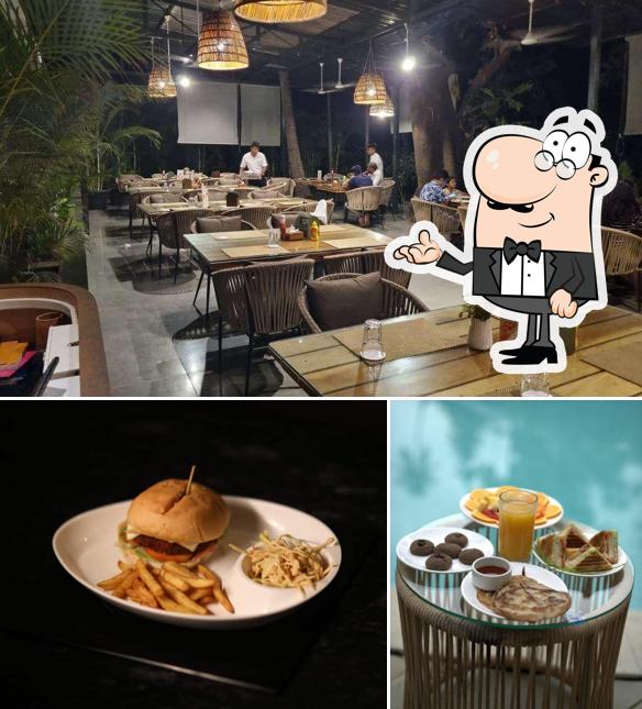 This is the photo showing interior and burger at Mangrove Cafe Juice Bar Restaurant