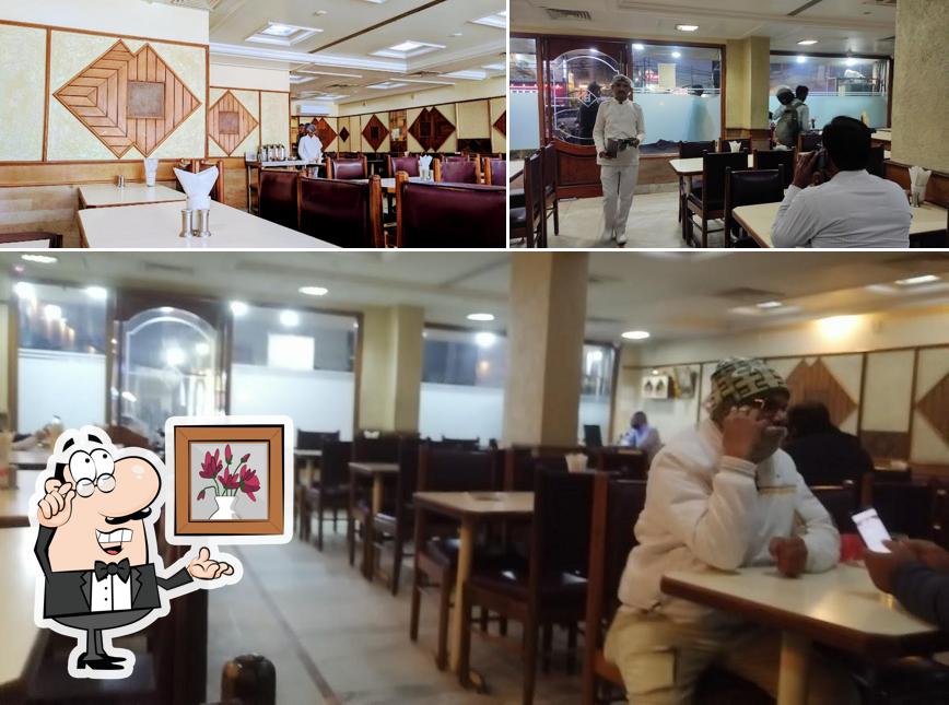 Take a seat at one of the tables at Bansi Vihar Restaurant