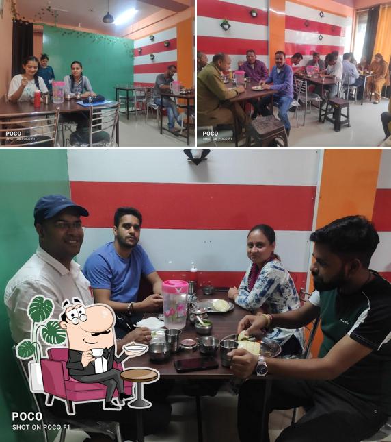 Take a seat at one of the tables at JuST-In Cafe