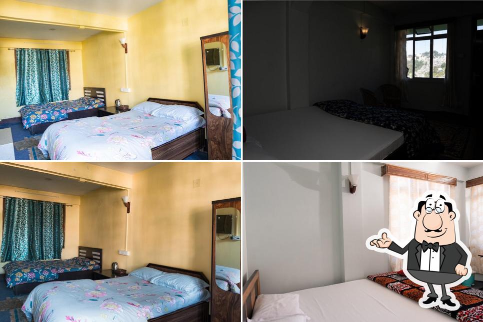 Take a seat at one of the tables at PARIJAT HOMESTAY DARJEELING