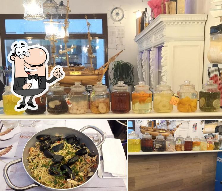 Guarda la immagine che presenta la interni e cibo di Ristorante I Marinai Di Napoli