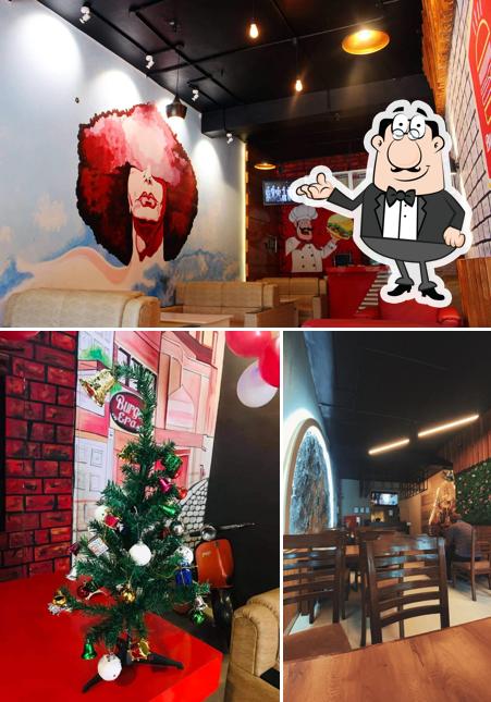 Take a seat at one of the tables at Burger Era