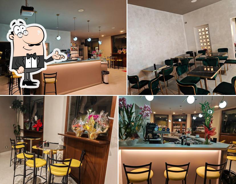 Dai un'occhiata agli interni di Queen Bar