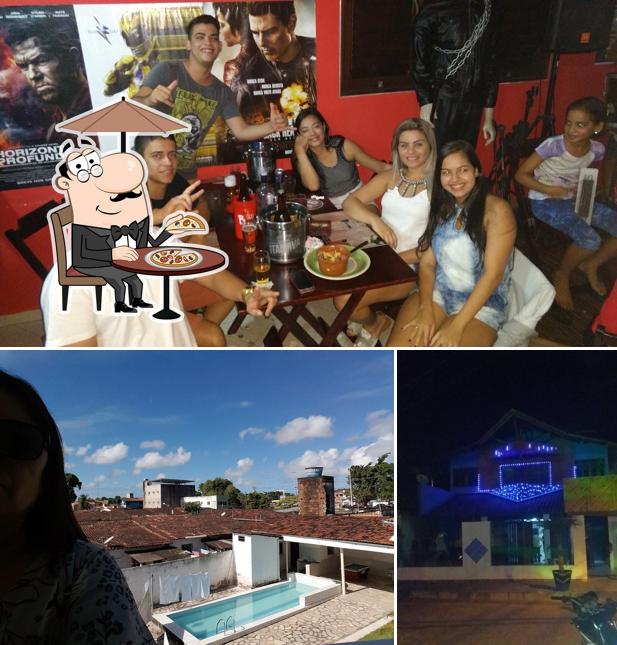O Pizzaria Cine Prime se destaca pelo exterior e mesa de jantar