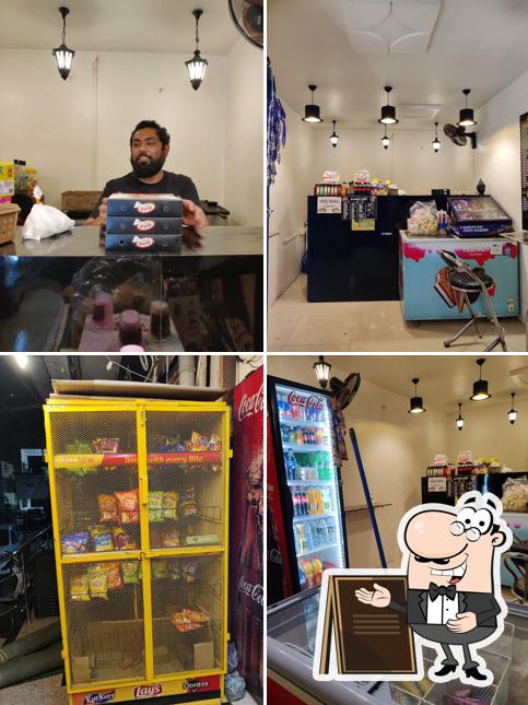 Among various things one can find exterior and interior at D WHITE CAFE