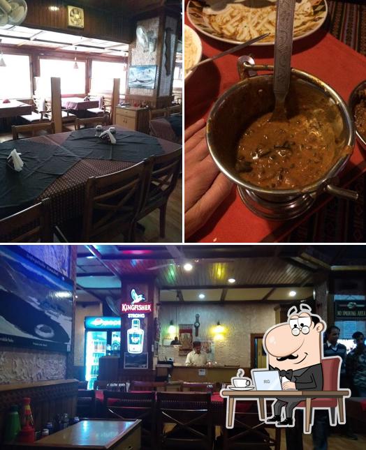 Take a seat at one of the tables at Khyber Restaurant And Bar