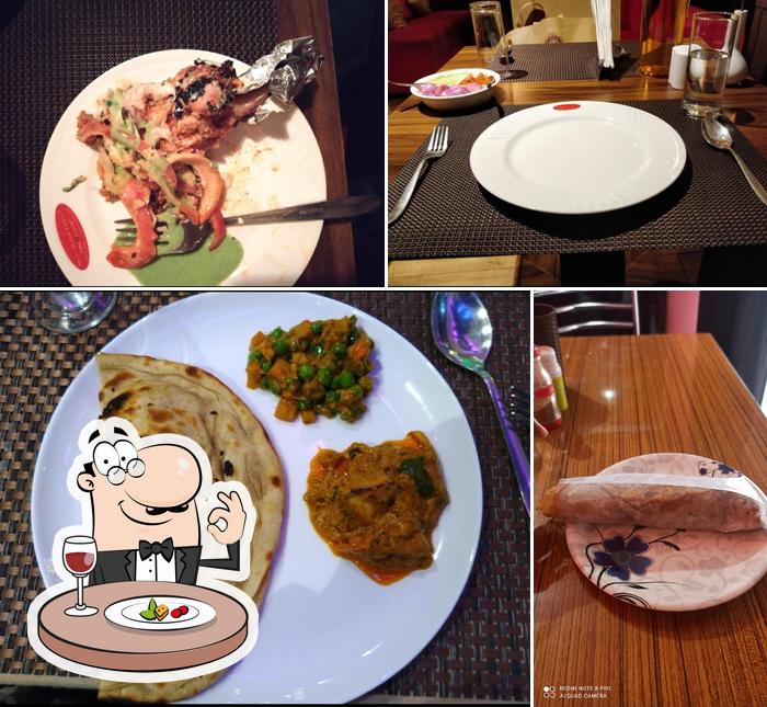 Among different things one can find food and dining table at Sarai Food Cafe