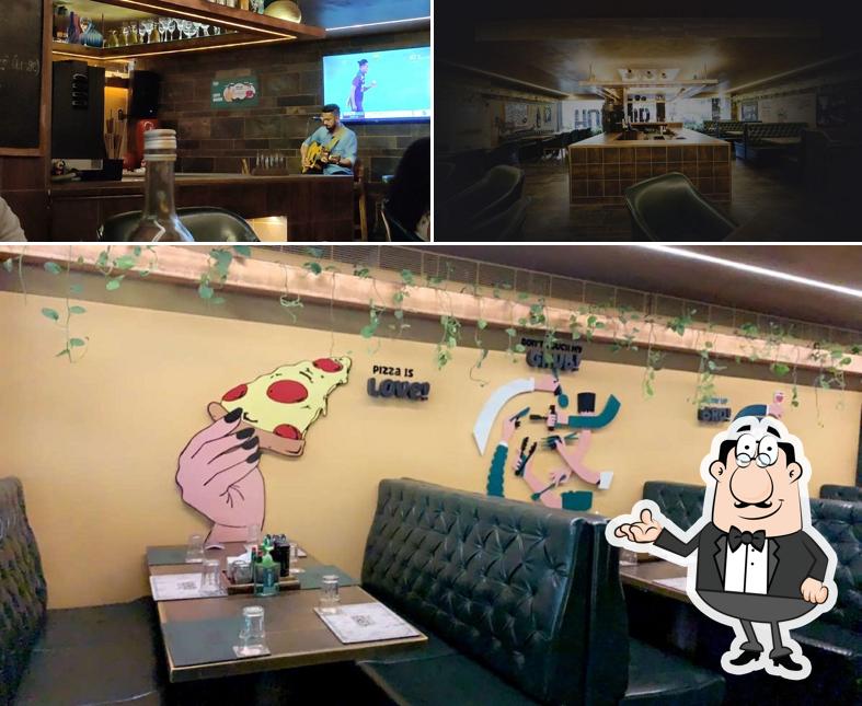 Take a seat at one of the tables at Hobnob Gourmet Cafébar