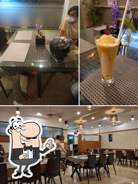 Check out the picture displaying interior and beverage at Quilon Restaurant Vallamkulam