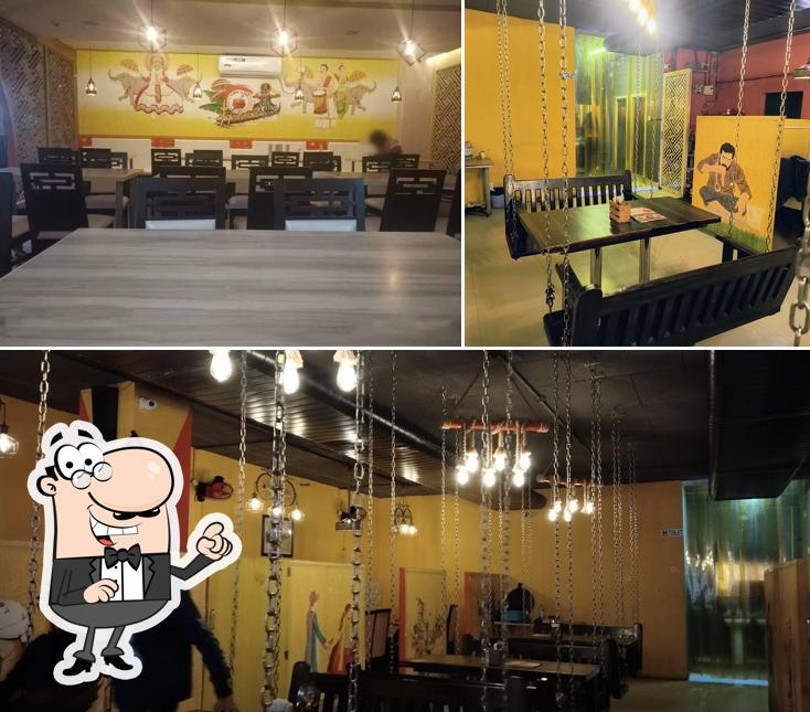 Take a seat at one of the tables at Naidu Gari Kunda Biryani-KPHB