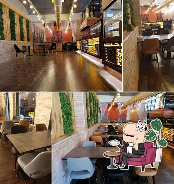 Siediti a un tavolo di Genc kebap - pizzeria grill bar