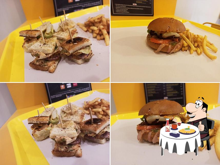 Order a burger at NIBBLES Fast Food Fine Dine Cafe